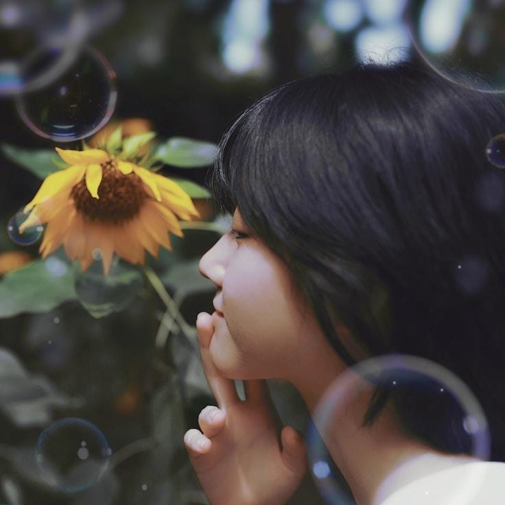 Avery Lin, Lead Design Curator at Quantiro Vexalum, reviewing corporate floral arrangements